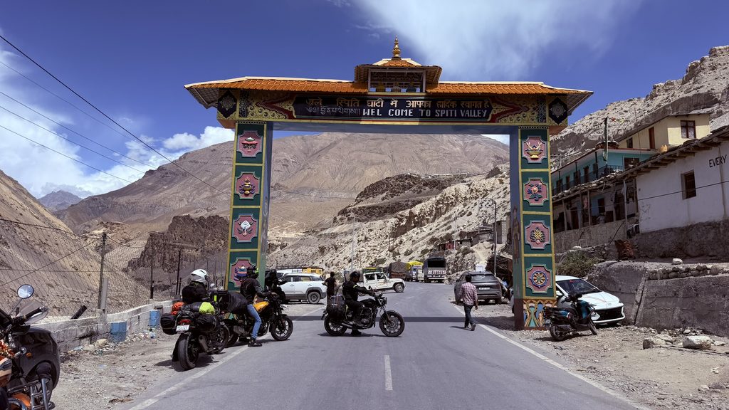 Entering Spiti Valley gate on the way to Kaza with bikers crossing the iconic arch