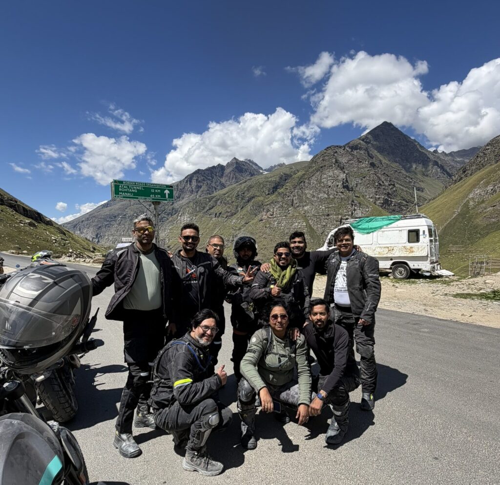Riders stopping after reaching smooth tarmac road in Spiti